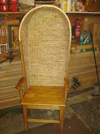 Gents Hooded Orkney chair in Driftwood with a solid seat with light stain