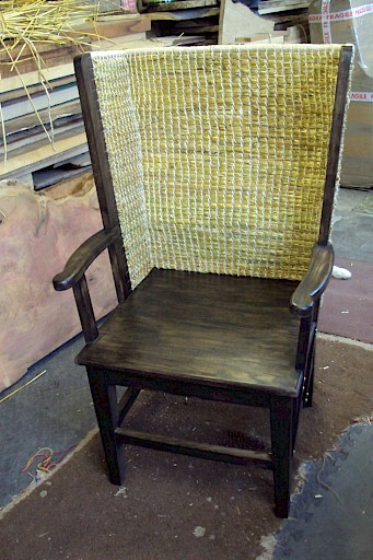 Gents Orkney Chair in Red Oak with solid seat and an antique finish