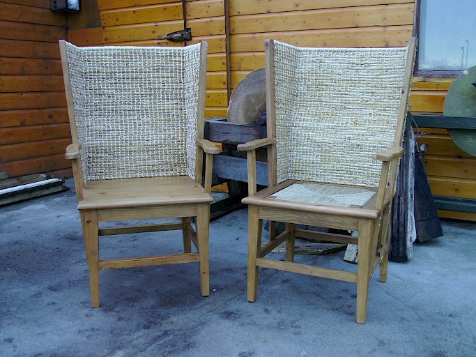 Gents Orkney Chair in Driftwood with a solid seat and light stain. With a sea grass seat and a light stain